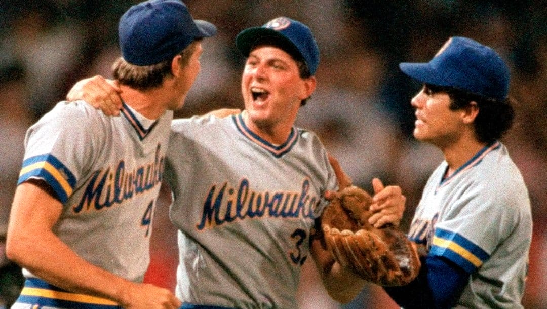 Milwaukee Brewers pitcher Dan Plesac, center, is congratulated by teammates Mike Birkbeck, left, and Juan Nieves after their 5-4 win over the Chicago White Sox in Chicago, Ill., on April 20, 1987.