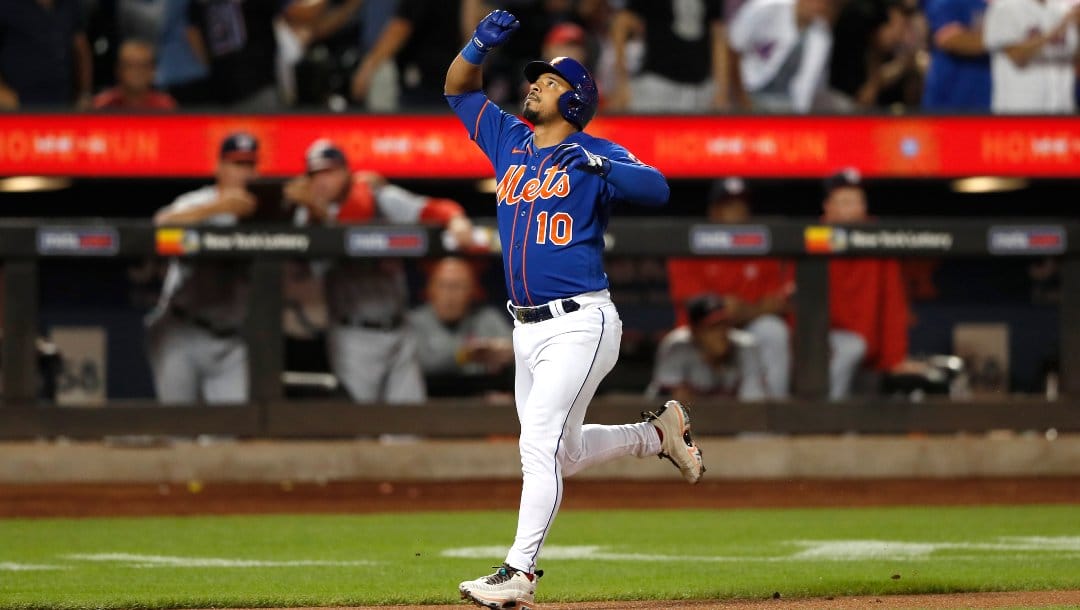 New York Mets third baseman Eduardo Escobar (10) reacts after hitting a home run against the Washington Nationals during the third inning of a baseball game Saturday, Sept. 3, 2022, in New York.