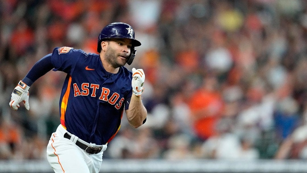 Houston Astros' Jose Altuve runs up the first base line after hitting a double during the third inning of a baseball game against the Texas Rangers Sunday, May 22, 2022, in Houston.