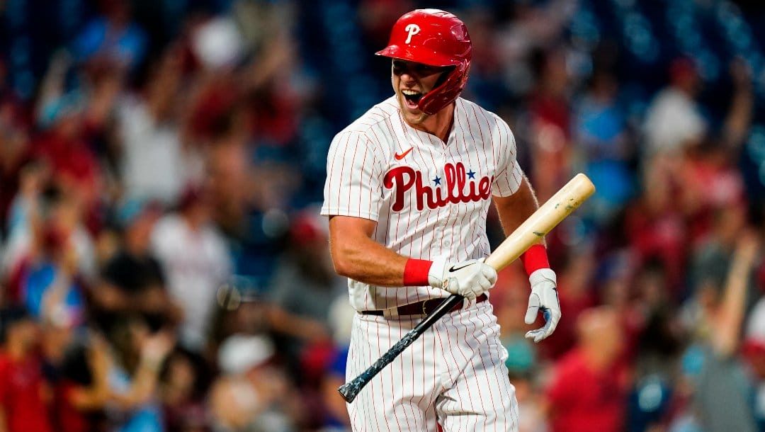 Philadelphia Phillies' Rhys Hoskins reacts after hitting a three-run home run off Miami Marlins' Trevor Rogers during the fourth inning of a baseball game Tuesday, June 14, 2022, in Philadelphia.