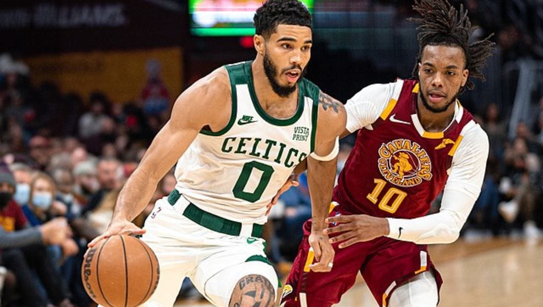 Jayson Tatum of the Boston Celtics drives past Darius Garland of the Cleveland Cavaliers during an NBA game in November 2021.