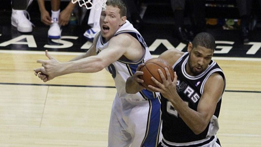 Darius Songaila loses the fight for a rebound against Tim Duncan during a game between the San Antonio Spurs and Washington Wizards.
