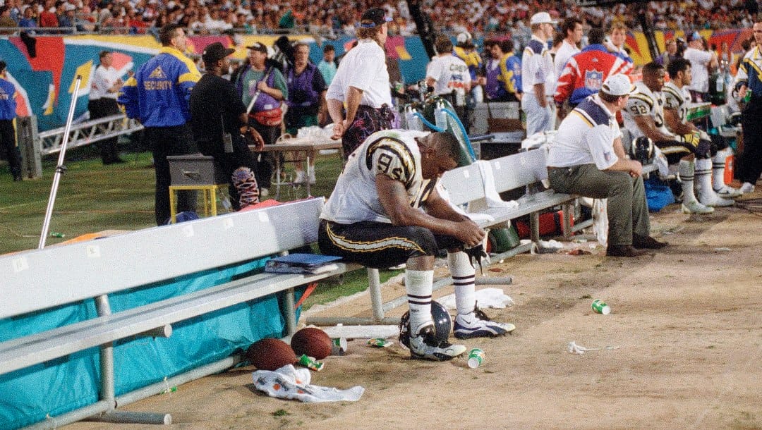 San Diego Chargers Chris Mims sits dejectedly on the bench during his team’s 49-26 loss to the San Francisco 49ers in Super Bowl XXIX in Miami, Jan. 29, 1995. (AP Photo/Lenny Ignelzi)