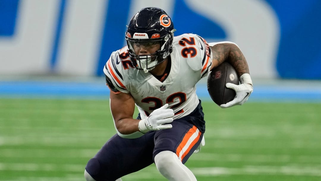Chicago Bears running back David Montgomery rushes during the second half of an NFL football game against the Detroit Lions, Sunday, Jan. 1, 2023, in Detroit. (AP Photo/Paul Sancya)