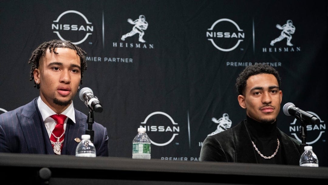 Ohio State quarterback C.J. Stroud, left, speaks alongside Alabama quarterback Bryce Young during a news conference before attending the Heisman Trophy award ceremony, Saturday, Dec. 11, 2021, in New York. (AP Photo/John Minchillo)