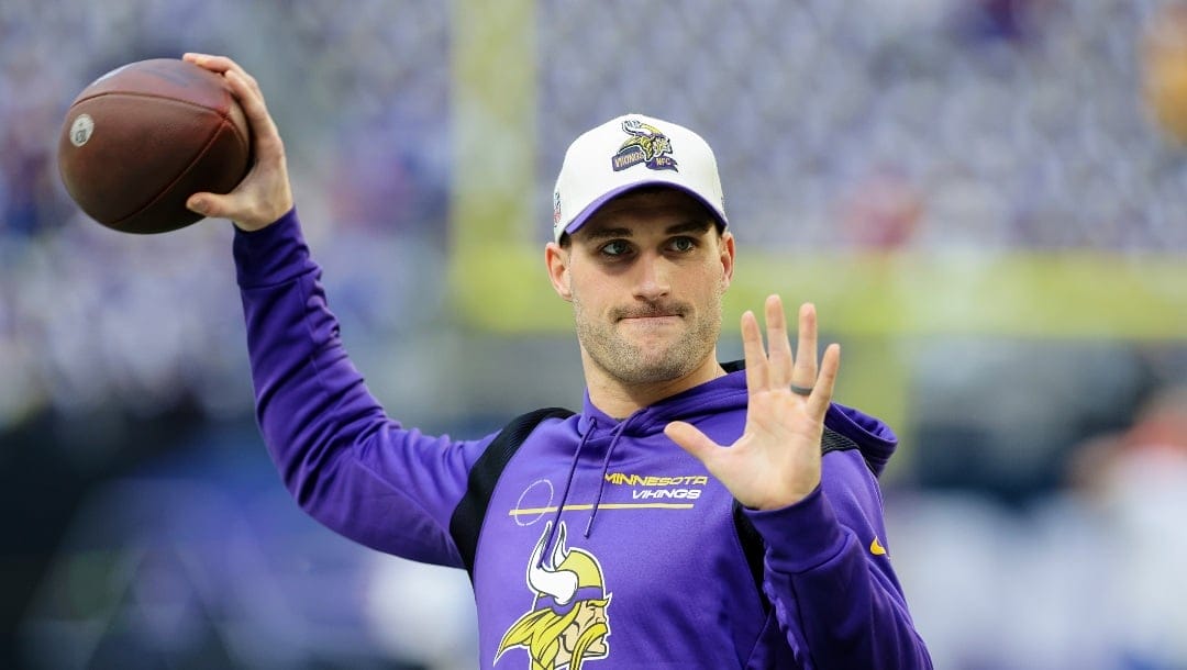 Minnesota Vikings quarterback Kirk Cousins warms up before an NFL wild-card football game against the New York Giants, Sunday, Jan. 15, 2023 in Minneapolis. (AP Photo/Stacy Bengs)