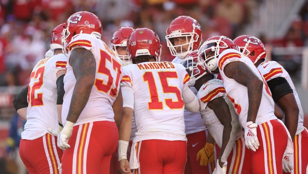 Kansas City Chiefs quarterback Patrick Mahomes (15) talks to teammates in the huddle in the fourth quarter during an NFL football game against the San Francisco 49ers, Sunday, Oct. 23, 2022 in Santa Clara, Calif. (AP Photo/Lachlan Cunningham)