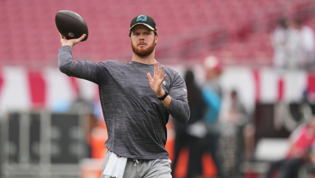 Carolina Panthers quarterback Sam Darnold (14) warms up before during an NFL football game against the Tampa Bay Buccaneers, Sunday, January 1, 2023, in Tampa, Fla. (AP Photo/Peter Joneleit)