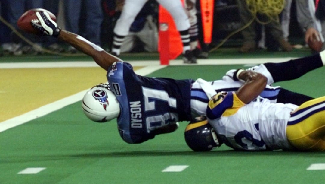 FILE - In this Jan. 30, 2000, file photo, Tennessee Titans wide receiver Kevin Dyson (87) tries but fails to get the ball over the goal line as he is tackled by St. Louis Rams' Mike Jones on the final play of Super Bowl XXXIV in Atlanta. The Rams won 23-16. Seven of the 12 teams that are in the NFL playoffs have never won the big game, matching the largest group of playoff-bound squads with not-so-Super pedigrees since the 1999 season.(AP Photo/John Gaps III)