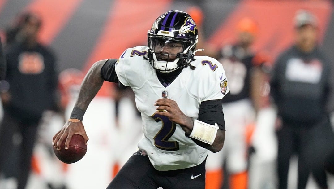 Baltimore Ravens quarterback Tyler Huntley runs with the ball during the second half of NFL wild-card playoff football game against the Cincinnati Bengals in Cincinnati, Sunday, Jan. 15, 2023. The Bengals won 24-17. (AP Photo/Darron Cummings)