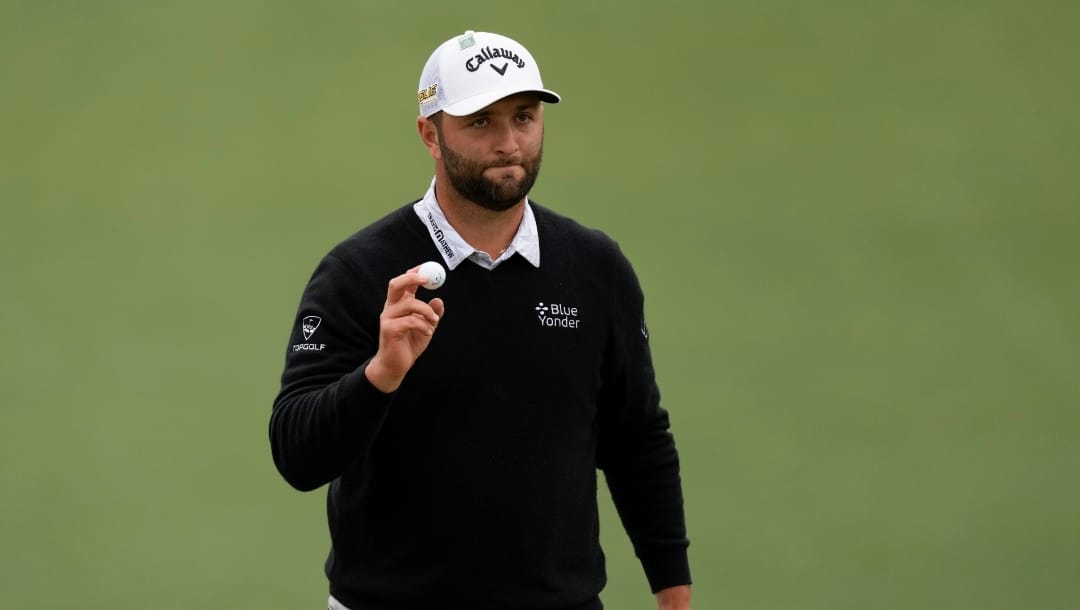 Jon Rahm, of Spain, holds up his ball after a birdie on the second hole during the third round at the Masters golf tournament on Saturday, April 9, 2022, in Augusta, Ga. (AP Photo/Matt Slocum)