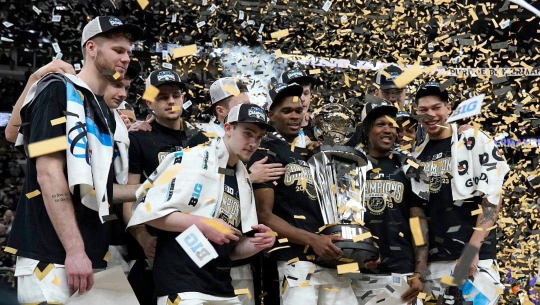 The Purdue Boilermakers celebrate the team's 67-65 win over Penn State for the Big Ten tournament championship in an NCAA college basketball game Saturday, March 11, 2023, in Chicago. (AP Photo/Nam Y. Huh)
