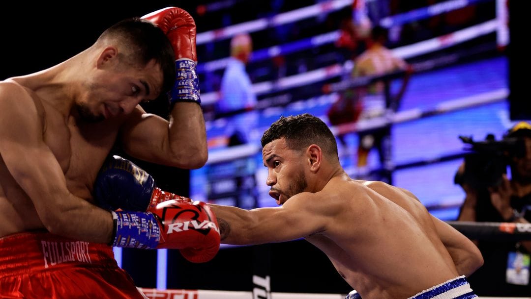Robeisy Ramirez, right, punches Jose Matias Romero in a featherweight boxing match Saturday, Oct. 29, 2022, in New York.
