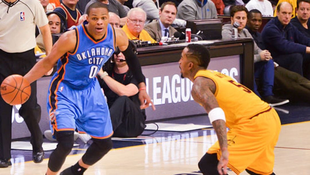 Russell Westbrook of the Oklahoma City Thunder against J. R. Smith of the Cleveland Cavaliers in a game in January 2015.