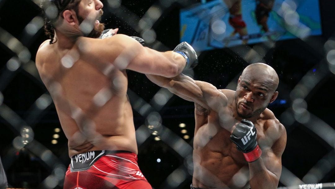 Kamaru Usman punches Jorge Masvidal, left, during a UFC 261 mixed martial arts fight early Sunday morning, April 25, 2021.