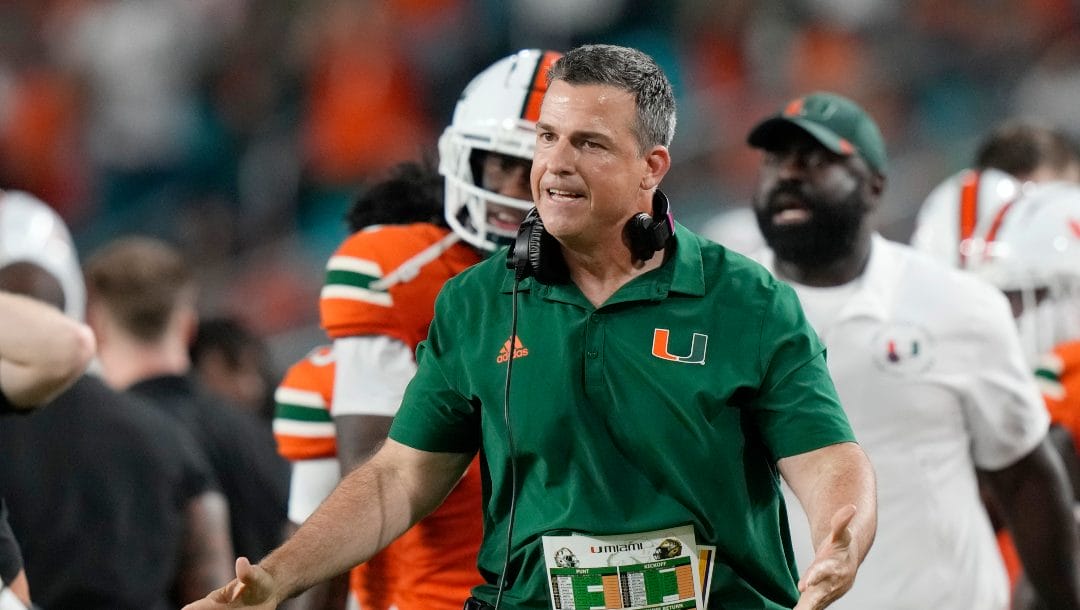 Miami head coach Mario Cristobal reacts during the first half of an NCAA college football game against Pittsburgh, Saturday, Nov. 26, 2022, in Miami Gardens, Fla.
