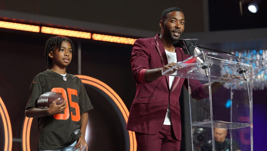 Andrew Hawkins, right, and Austin Hawkins announce the Cleveland Browns pick during the 2022 NFL Draft on Friday, April 29, 2022, in Las Vegas.