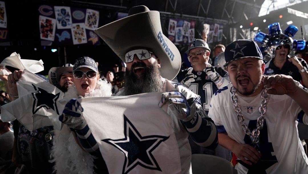 Dallas Cowboys fan cheer during the second round of the NFL football draft Friday, April 29, 2022, in Las Vegas.