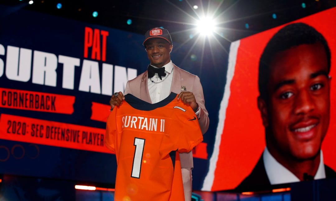 Alabama cornerback Patrick Surtain II holds a team jersey after he was chosen by the Denver Broncos with the ninth pick in the NFL football draft, Thursday, April 29, 2021, in Cleveland.