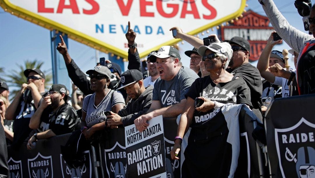 Fans cheer as the Oakland Raiders announce their fourth round draft pick during an NFL football draft event in Las Vegas, April 29, 2017.