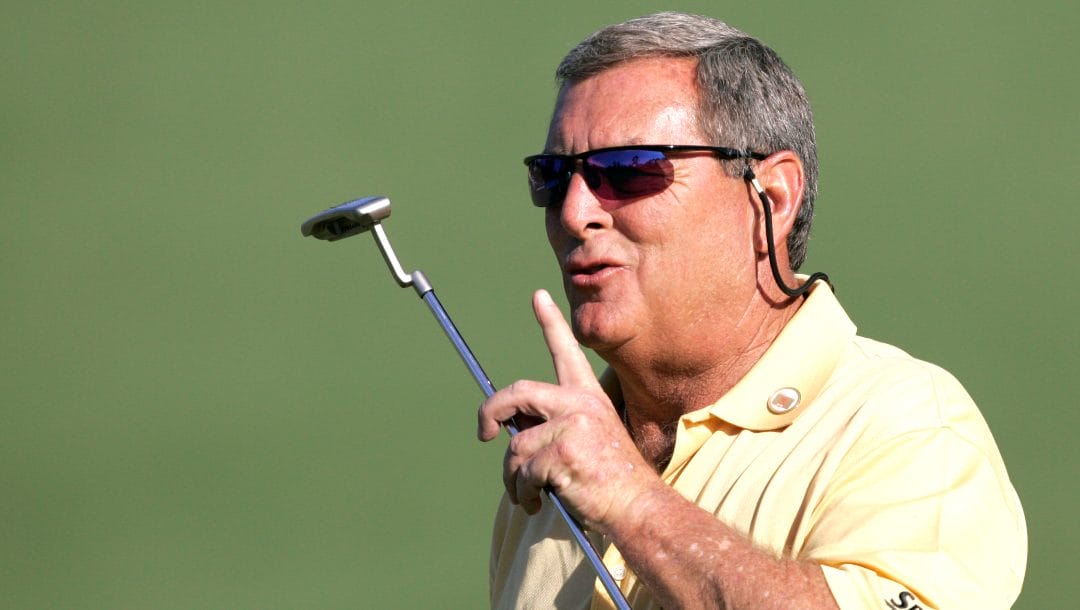 In this April 6, 2006, file photo, Fuzzy Zoeller encourages the crowd to be quiet on the second hole during first round play at the Masters golf tournament at the Augusta National Golf Club in Augusta, Ga.