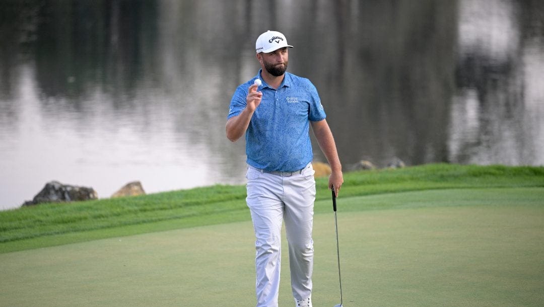 Jon Rahm, of Spain, acknowledges the crowd after making his putt on the 18th green during the first round of the Arnold Palmer Invitational golf tournament, Thursday, March 2, 2023, in Orlando, Fla.