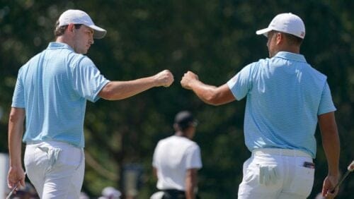 Patrick Cantlay, left, and Xander Schauffele celebrate on the fifth green during their foursomes match at the Presidents Cup golf tournament at the Quail Hollow Club, Thursday, Sept. 22, 2022, in Charlotte, N.C.