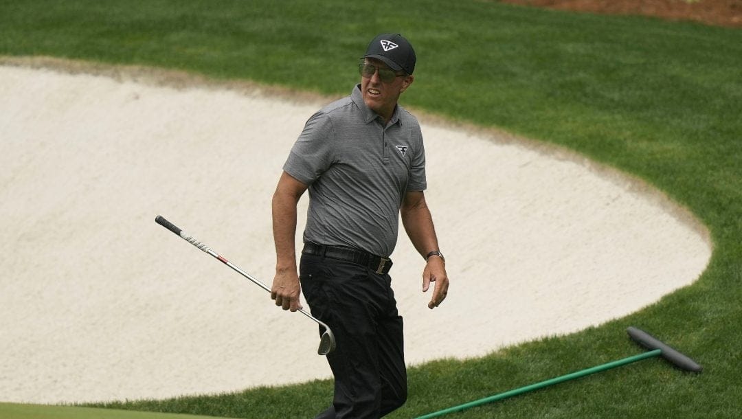 Phil Mickelson walks near the 13th green during a practice for the Masters golf tournament at Augusta National Golf Club, Tuesday, April 4, 2023, in Augusta, Ga.