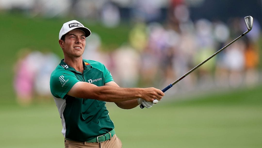 Viktor Hovland, of Norway, hits from the 18th fairway during the final round of The Players Championship golf tournament, Sunday, March 12, 2023, in Ponte Vedra Beach, Fla.