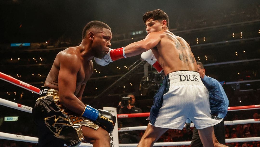 Ryan Garcia, right, and Javier Fortuna exchange punches during a lightweight boxing match Saturday, July 16, 2022.