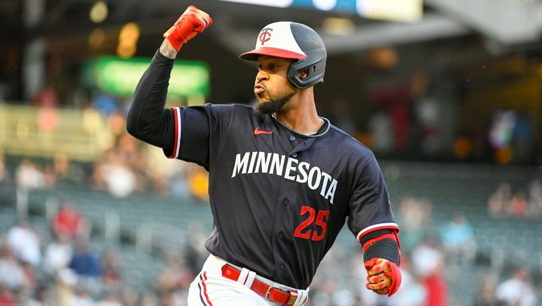 Minnesota Twins' Byron Buxton celebrates after hitting a two-run home run, the 100th home run of his career, during the first inning of the team's baseball game against the Chicago White Sox, Tuesday, April 11, 2023, in Minneapolis.