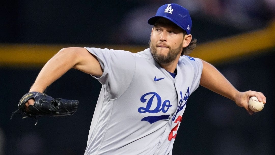 Los Angeles Dodgers starting pitcher Clayton Kershaw throws against the Arizona Diamondbacks during the first inning of a baseball game Friday, April 7, 2023, in Phoenix.