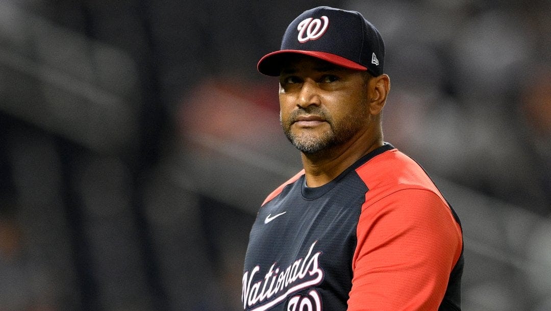 Washington Nationals manager Dave Martinez walks back to the dugout after a pitching change during a baseball game against the Atlanta Braves early Saturday, Aug. 14, 2021, in Washington.