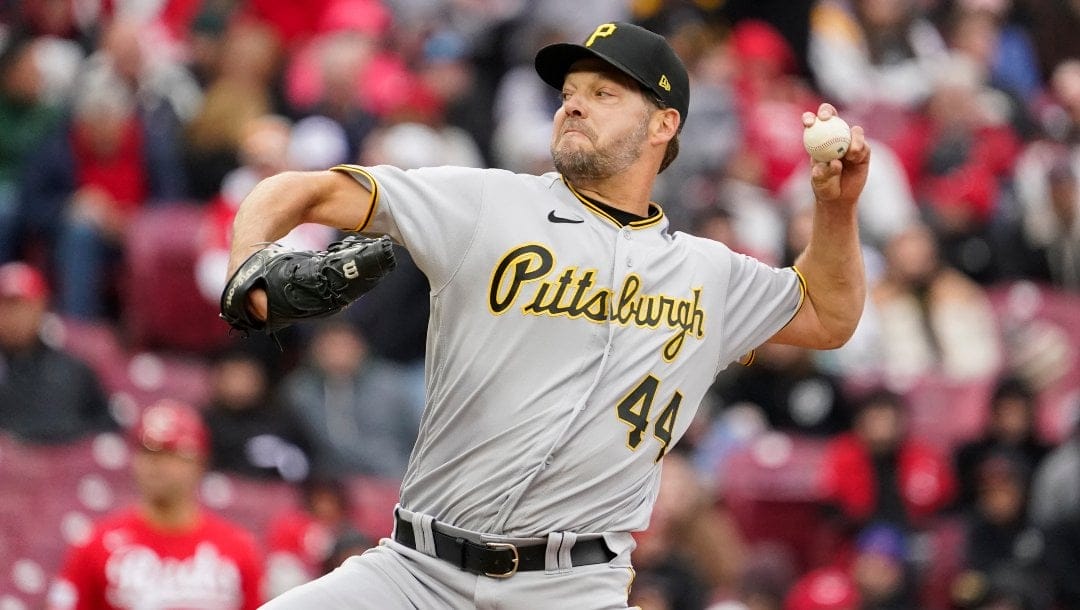 Pittsburgh Pirates starting pitcher Rich Hill delivers during the first inning of a baseball game against the Cincinnati Reds, Saturday, April 1, 2023, in Cincinnati.