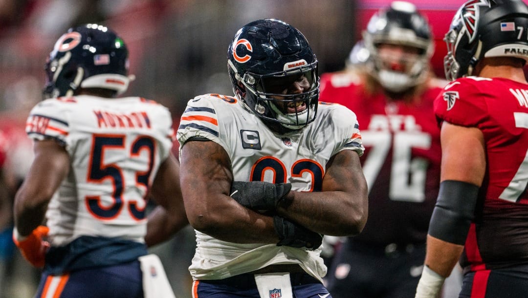 Chicago Bears defensive tackle Justin Jones (93) celebrates during the first half of an NFL football game against the Atlanta Falcons, Sunday, Nov. 20, 2022, in Atlanta. The Atlanta Falcons won 27-24. (AP Photo/Danny Karnik)