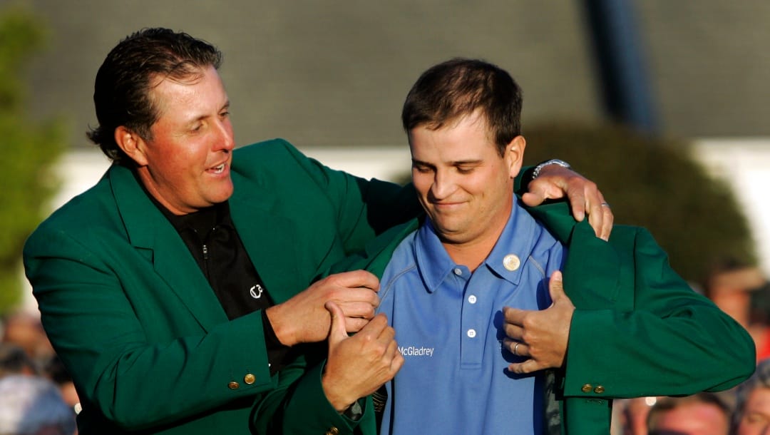 Zach Johnson receives the Masters green jacket from last year's champion Phil Mickelson after winning the 2007 Masters golf tournament at the Augusta National Golf Club in Augusta, Ga., Sunday, April 8, 2007