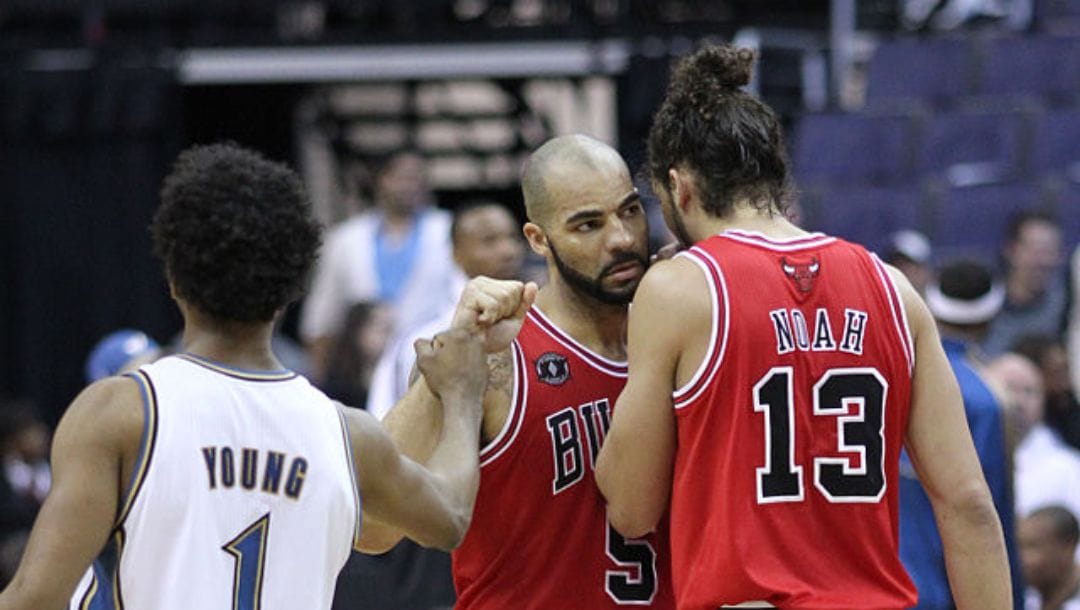 Nick Young, Carlos Boozer and Joakim Noah at Wizards versus Bulls on February 28, 2011 inside Capital One Arena.
