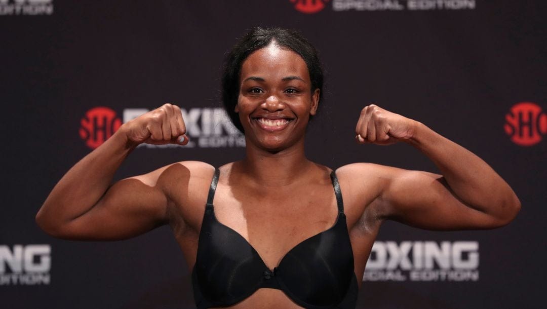 Boxer Claressa Shields flexes after her weigh-in, Thursday, June 21, 2018, in Detroit, for her fight against Hanna Gabriels.