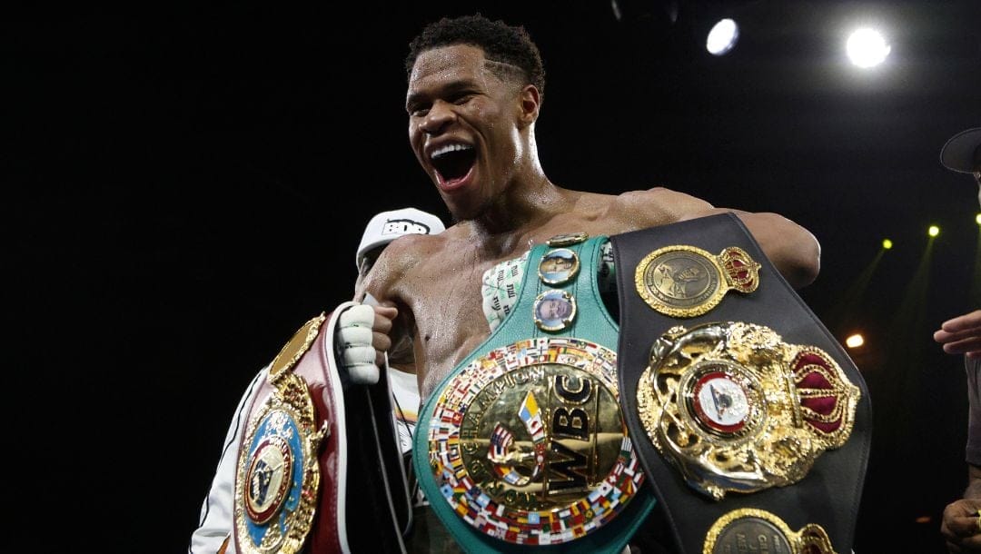 United States' Devin Haney displays his belts after defeating George Kambosos Jr. of Australia.