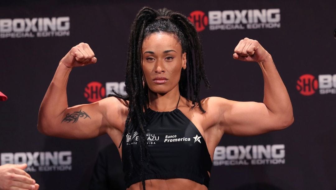 Hanna Gabriels of Costa Rica flexes after her weigh-in, Thursday, June 21, 2018, for her match against Claressa Shields.