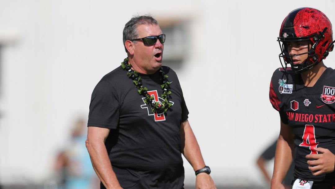 San Diego State head coach Brady Hoke is seen on the field before the start of the Hawaii Bowl NCAA college football game against Middle Tennessee, Saturday, Dec. 24, 2022, in Honolulu.