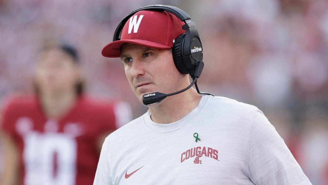 Washington State head coach Jake Dickert walks along the sideline during the second half of an NCAA college football game against California, on Oct. 1, 2022, in Pullman, Wash. Dickert has agreed to a contract extension that will keep him tied to the Cougars through the 2027 season.