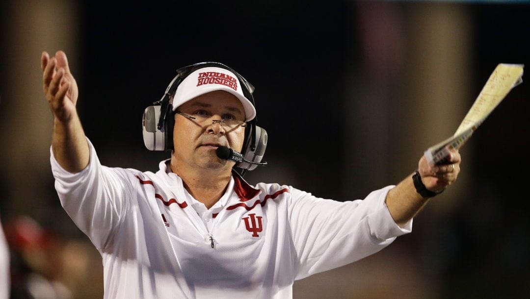 In this Nov. 14, 2015, file photo, Indiana head coach Kevin Wilson gestures during the second half of an NCAA college football game against Michigan, in Bloomington, Ind. Coach Wilson resigned Thursday, Dec. 1, 2016, less than a week after the Hoosiers became bowl-eligible for the second straight season.