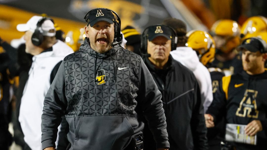 Appalachian State head coach Shawn Clark yells at an official in the second half during an NCAA football game against Georgia State on Wednesday, Oct. 19, 2022, in Boone, N.C. Appalachian State won 42-17.