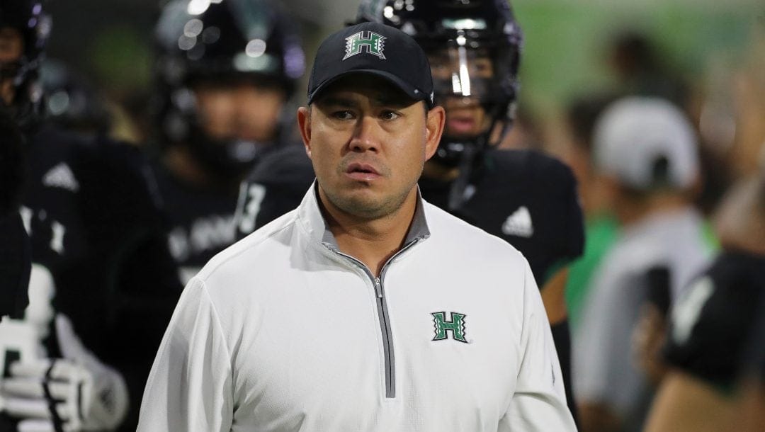 Hawaii coach Timmy Chang waits for the team's NCAA college football game against UNLV, Saturday, Nov. 19, 2022, in Honolulu.