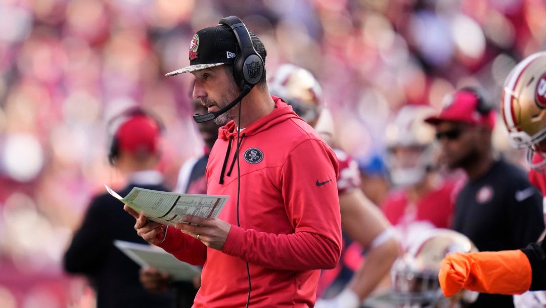 San Francisco 49ers coach Kyle Shanahan watches from the sideline during the first half of the team's NFL football game against the New Orleans Saints in Santa Clara, Calif., Nov. 27, 2022. Brian Daboll, Doug Pederson and Shanahan are the finalists for AP Coach of the Year award.