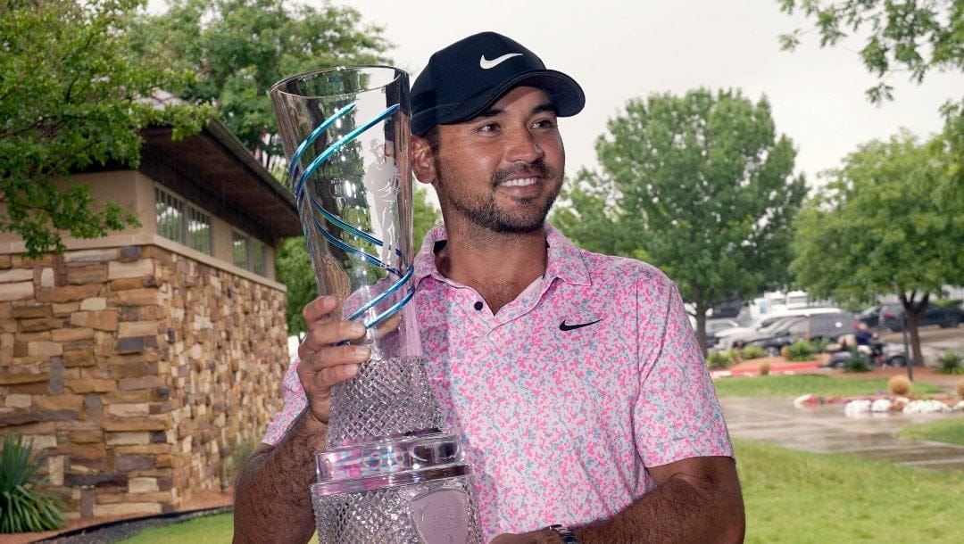 Jason Day, of Australia, poses for photos with the trophy after winning the Byron Nelson golf tournament in McKinney, Texas, Sunday, May 14, 2023.