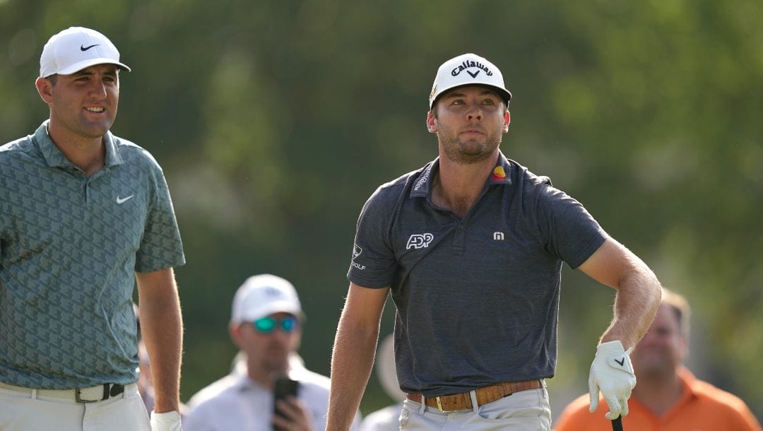 Sam Burns, right, and Scottie Scheffler stand on the 18th tee during a playoff in the final round of the Charles Schwab Challenge golf tournament at the Colonial Country Club in Fort Worth, Texas, Sunday, May 29, 2022. Burns won the tournament.