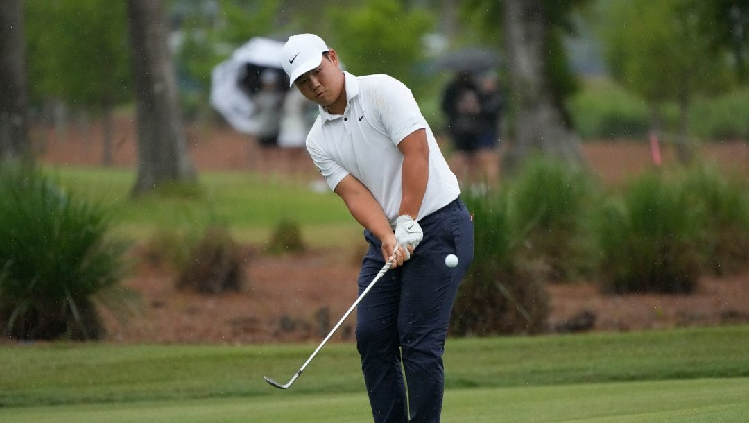 Tom Kim, of South Korea, chips onto the sixth green during the second round of the PGA Zurich Classic golf tournament at TPC Louisiana in Avondale, La., Friday, April 21, 2023.