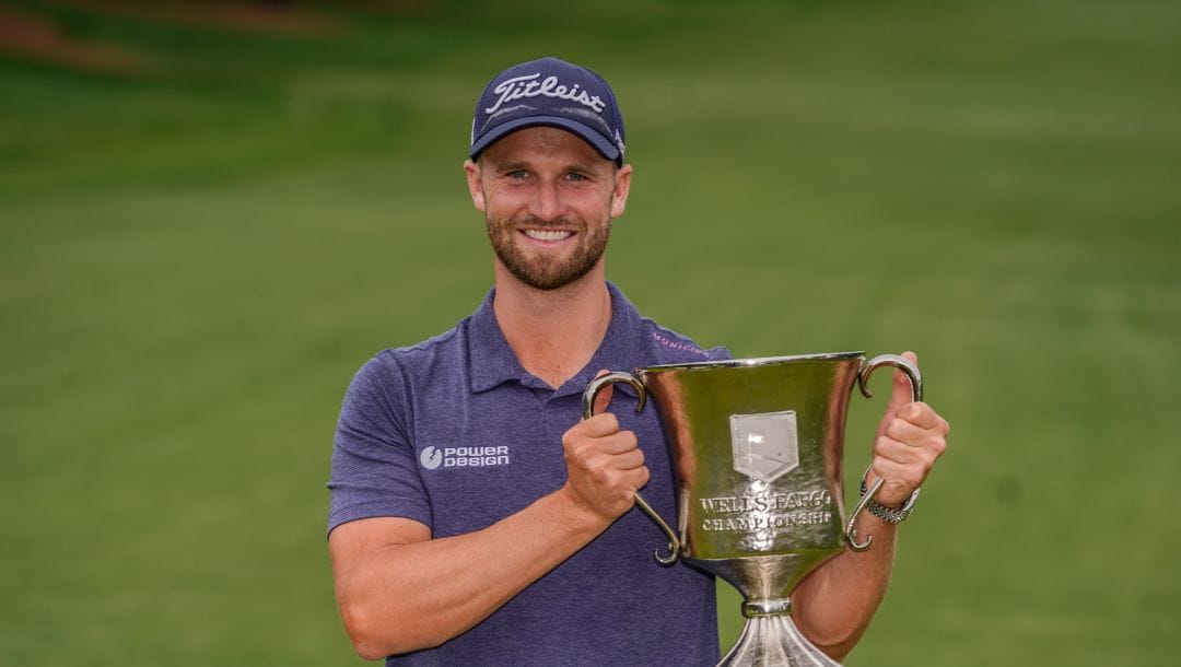 Wyndham Clark celebrates his victory after the final round of the Wells Fargo Championship golf tournament at the Quail Hollow Club on Sunday, May 7, 2023, in Charlotte, N.C.